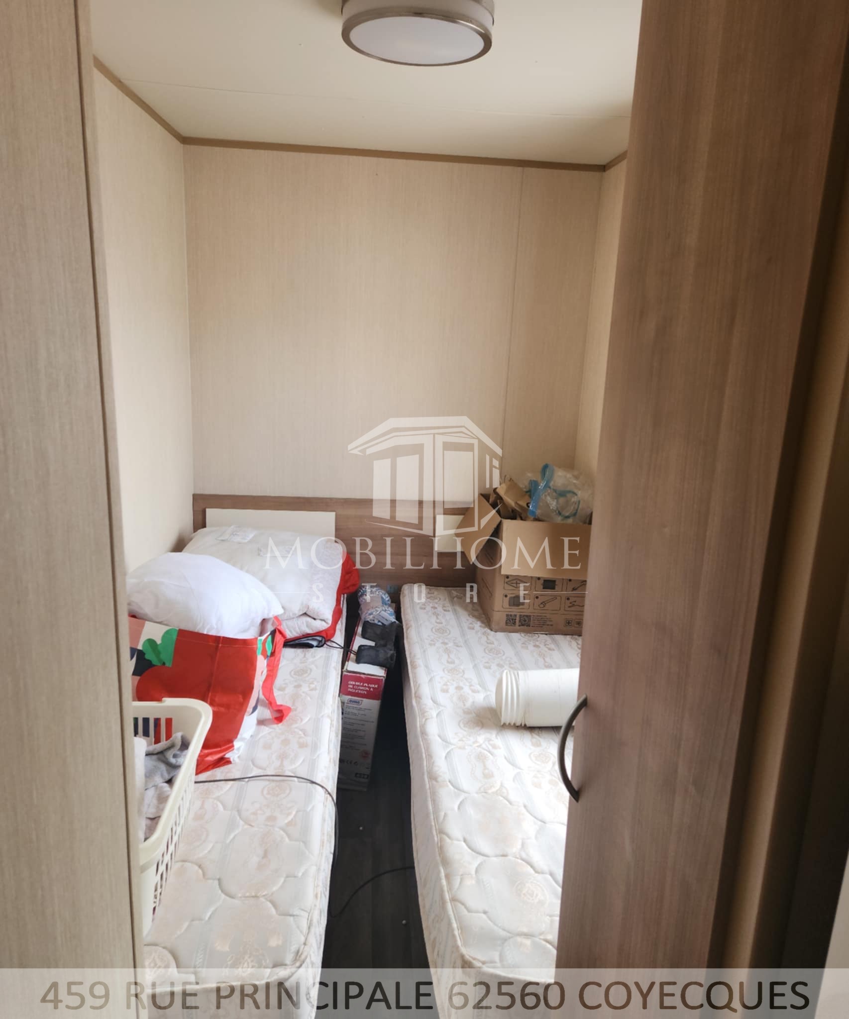 Photo de la deuxième chambre avec deux lits simple du mobil-home ABI TEBAY