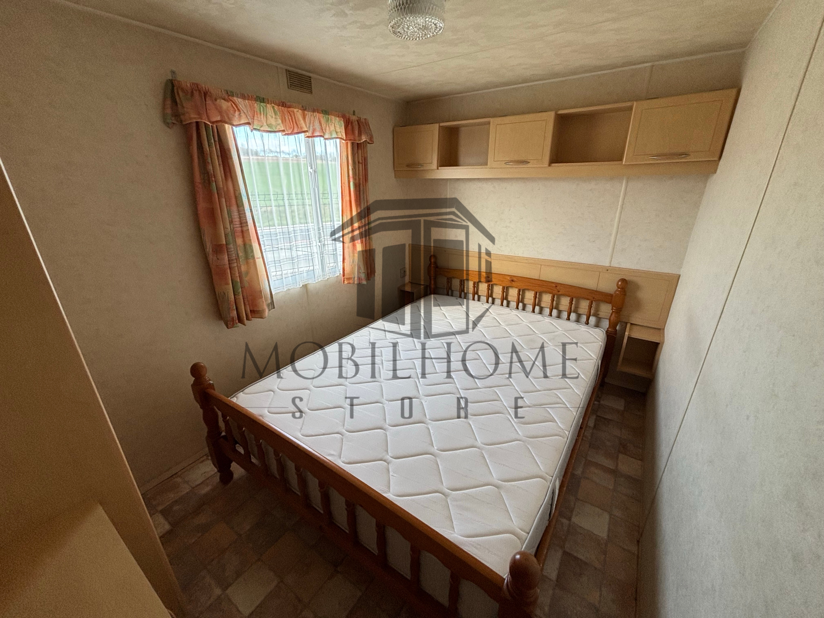 Chambre parentale avec un lit double du mobil-home Atlas Mirage