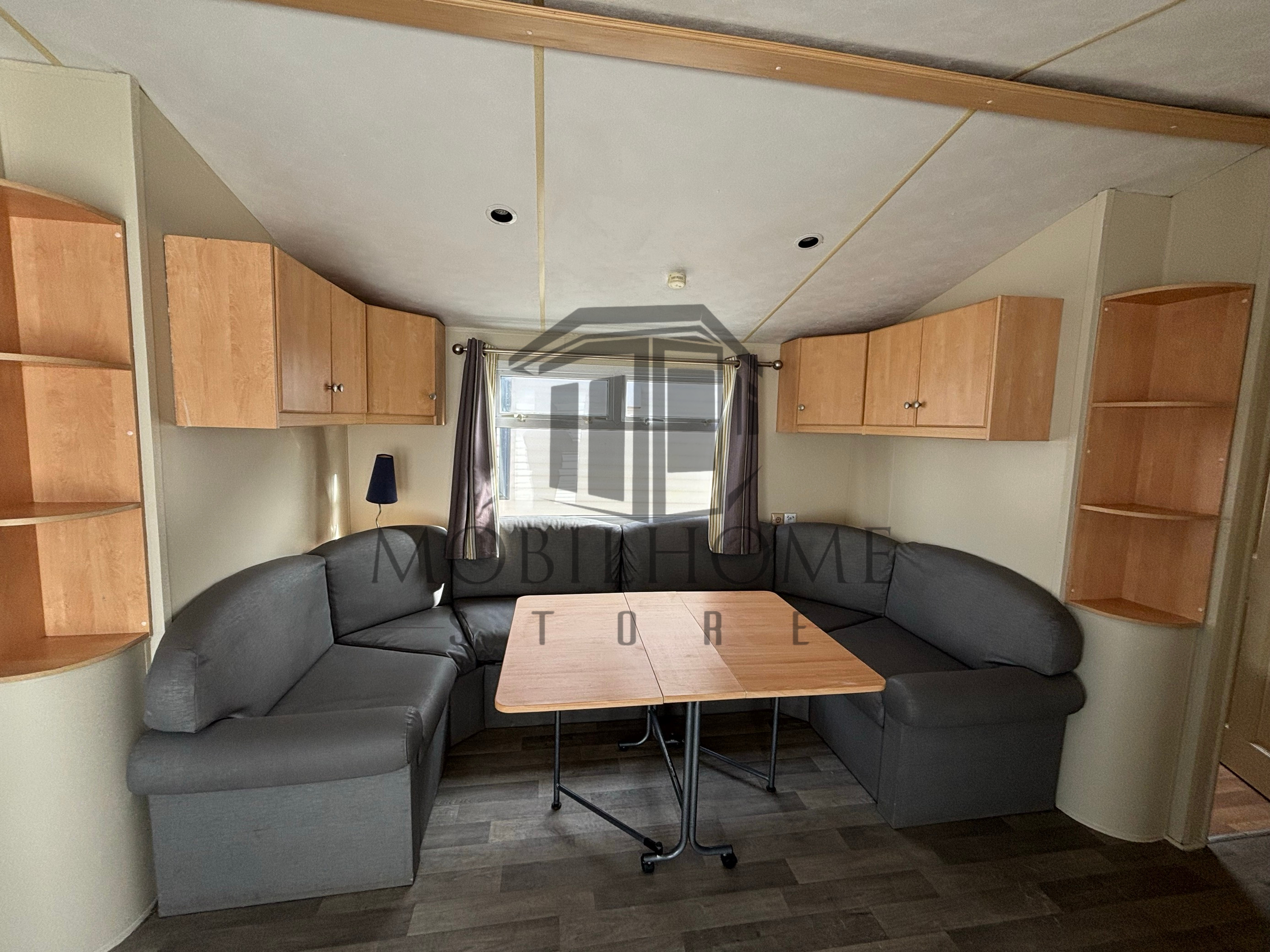 Salon et coin repas du mobil-home Willerby