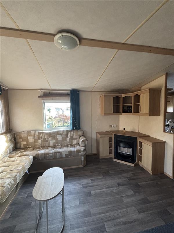 Salon du mobil-home ABY sur emplacement au camping de La Tentation