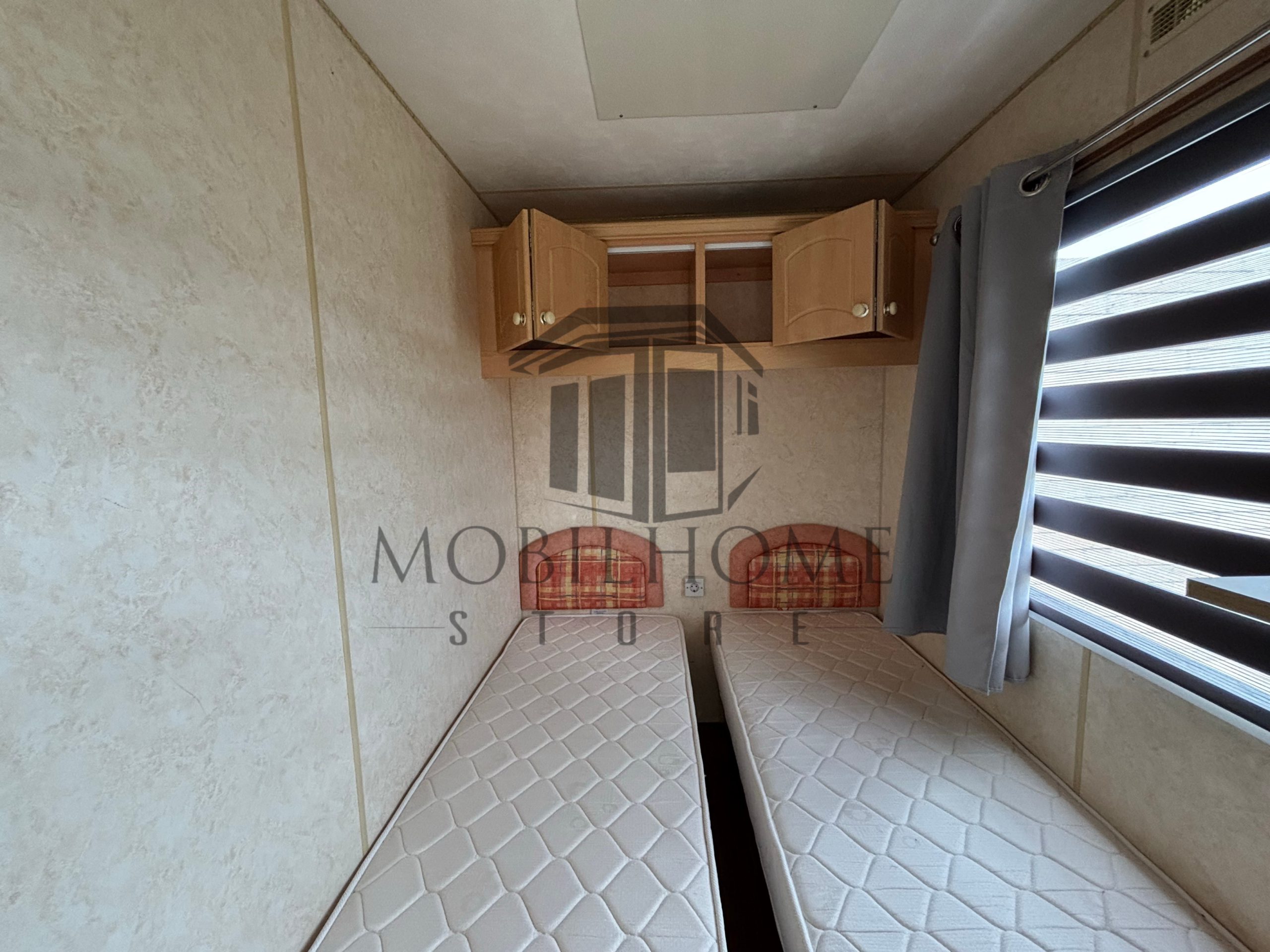 Deuxième chambre du mobil-home P82