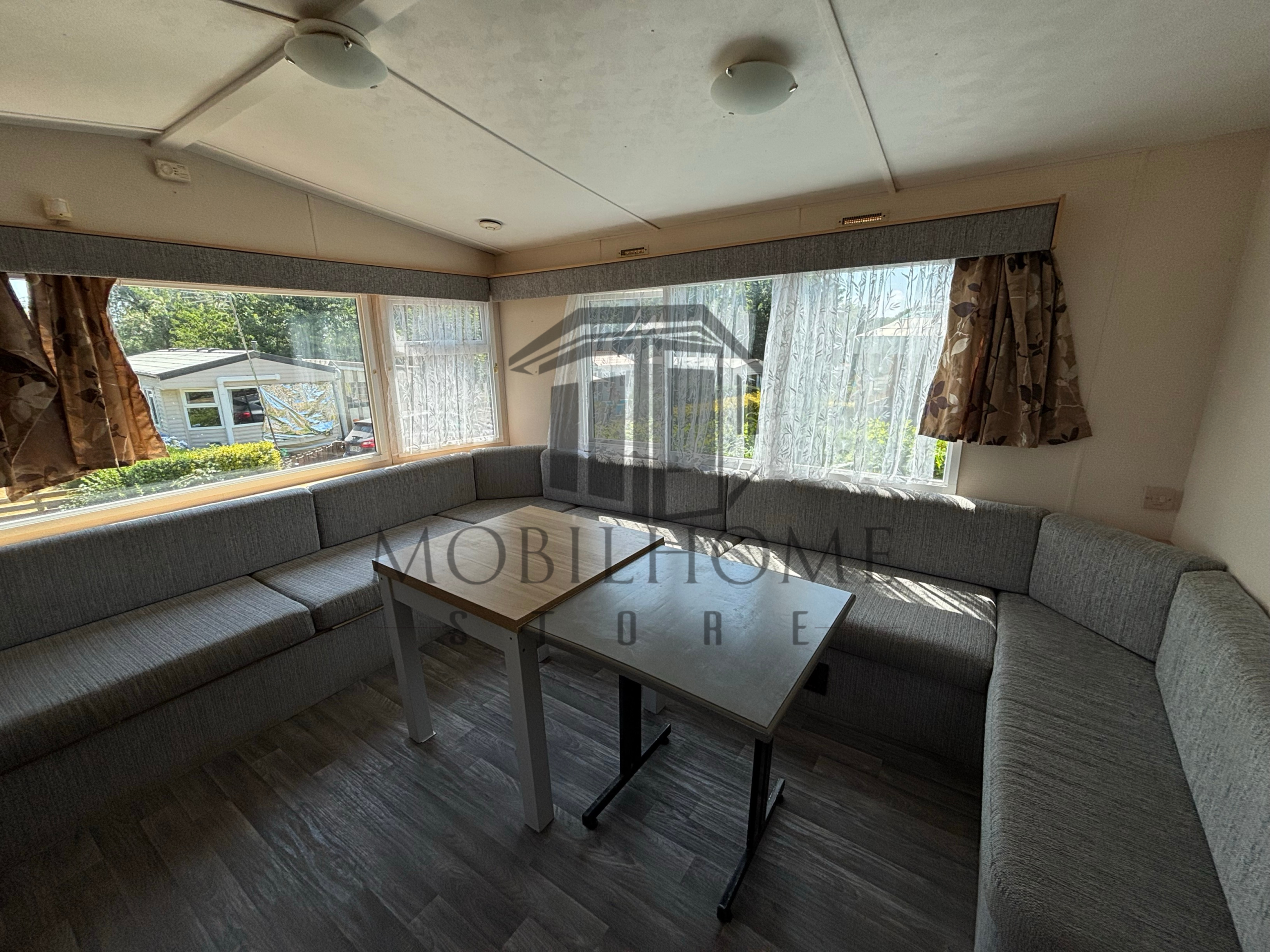 Coin repas et salon du mobil-home COSALT TORBAY